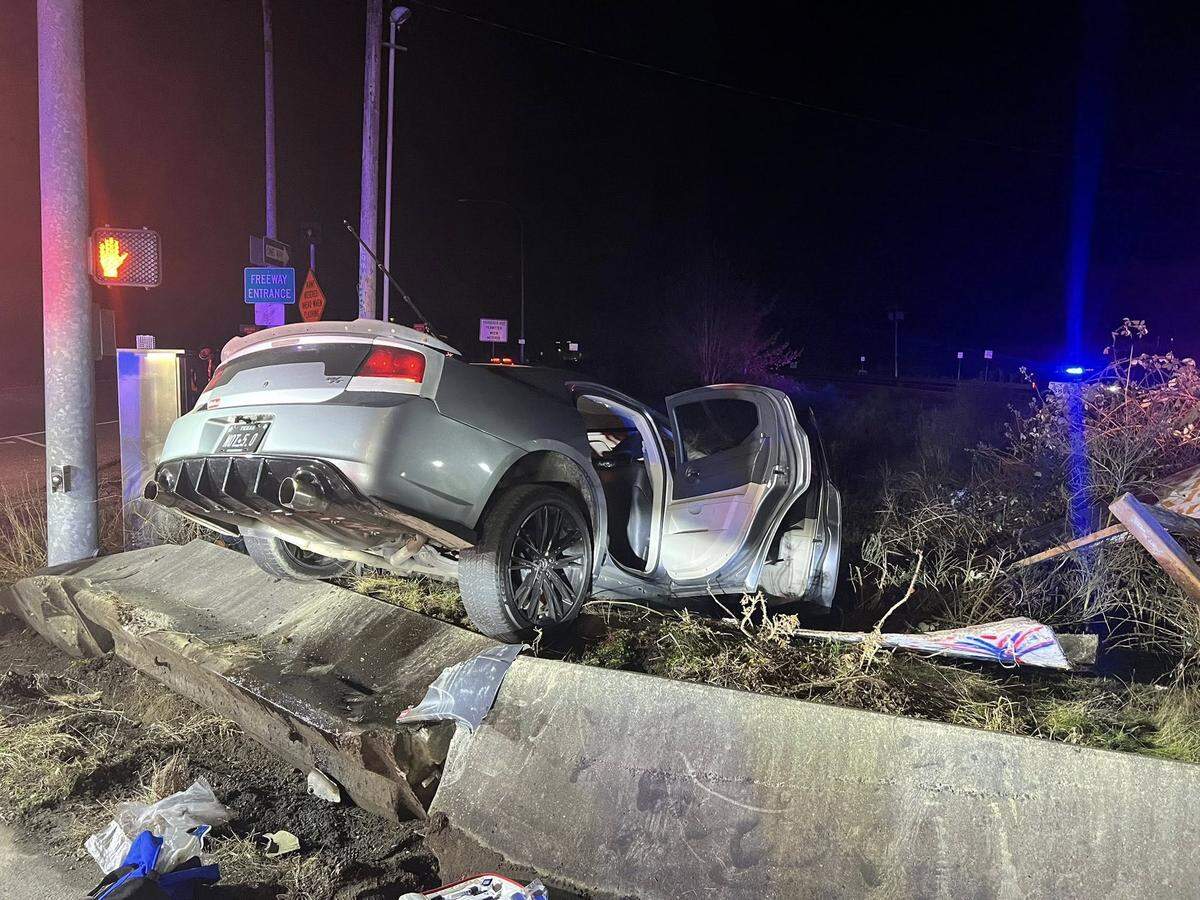 A 22-year-old driver was arrested after crashing into a cement barrier in the Nisqually Valley. A passenger was critically injured and taken to hospital.