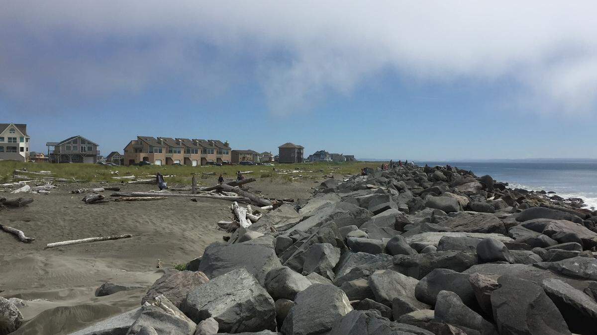 A row of houses and rentals sits by the beach in Ocean Shores, WA.