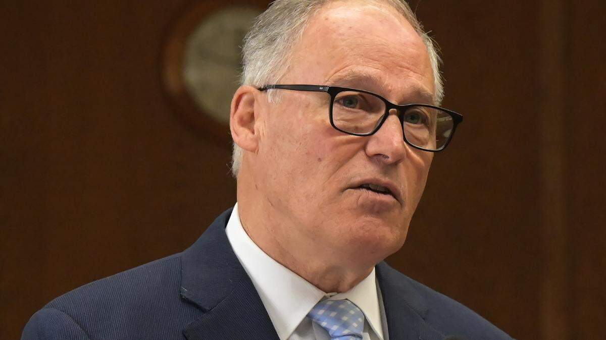 Gov. Jay Inslee answer questions from the Capitol press corps and other media during the annual Legislative Preview event in Olympia on Jan. 4, 2024.