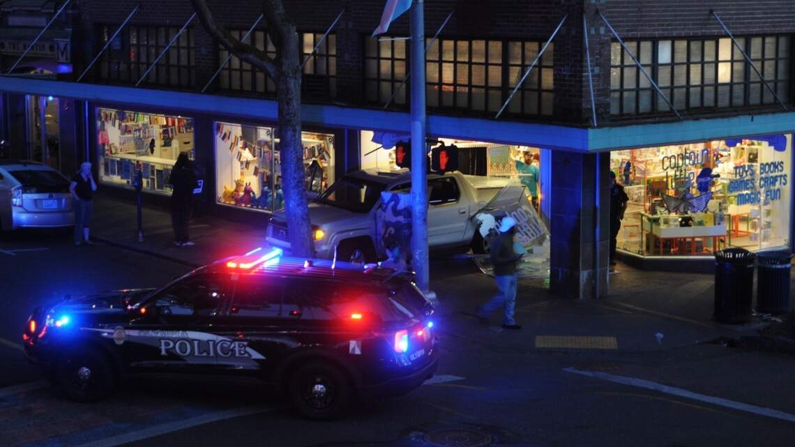 Pickup crashes through display window of downtown Olympia business