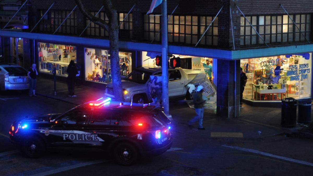 A pickup truck crashed through a display window at Captain Little, a downtown Olympia business, on Wednesday night.