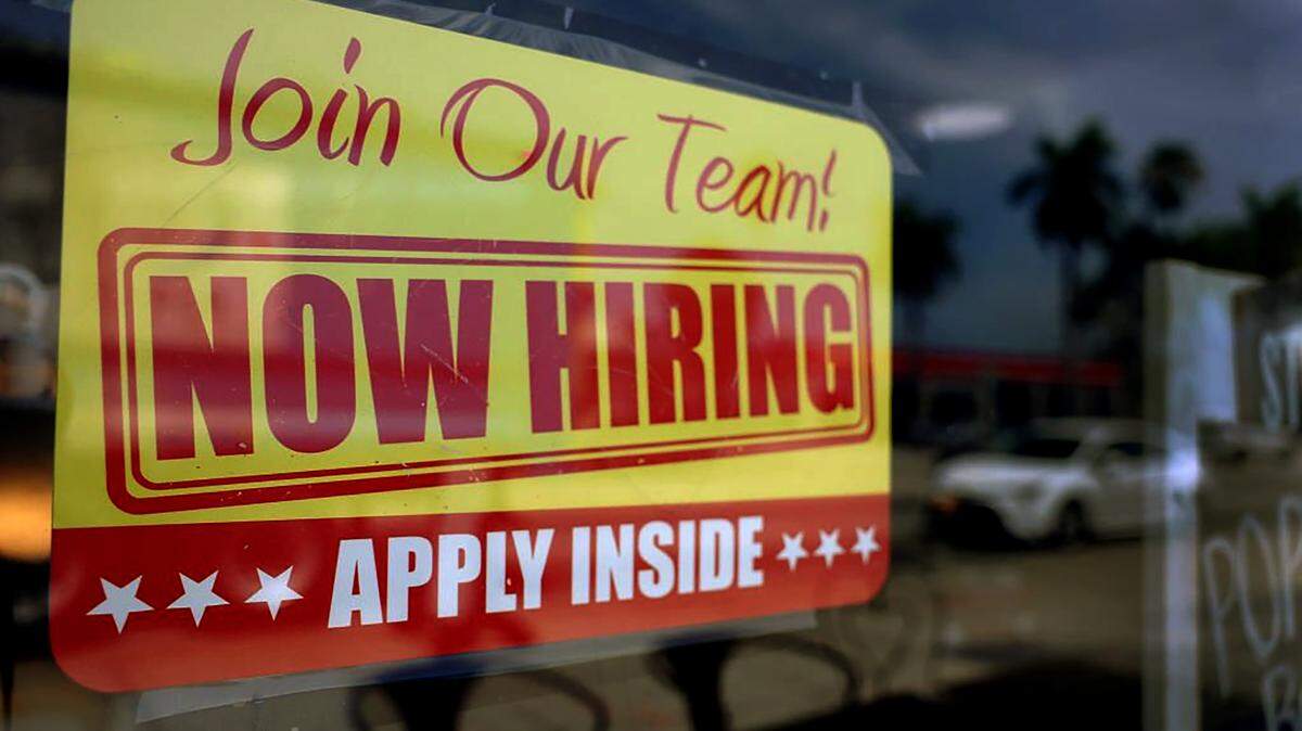MIAMI, FLORIDA - MAY 05: A 'Now Hiring' sign posted in the window of a restaurant looking to hire workers on May 05, 2023 in Miami, Florida. A report by the Bureau of Labor Statistics showed the US economy added 253,000 jobs in April. (Photo by Joe Raedle/Getty Images)