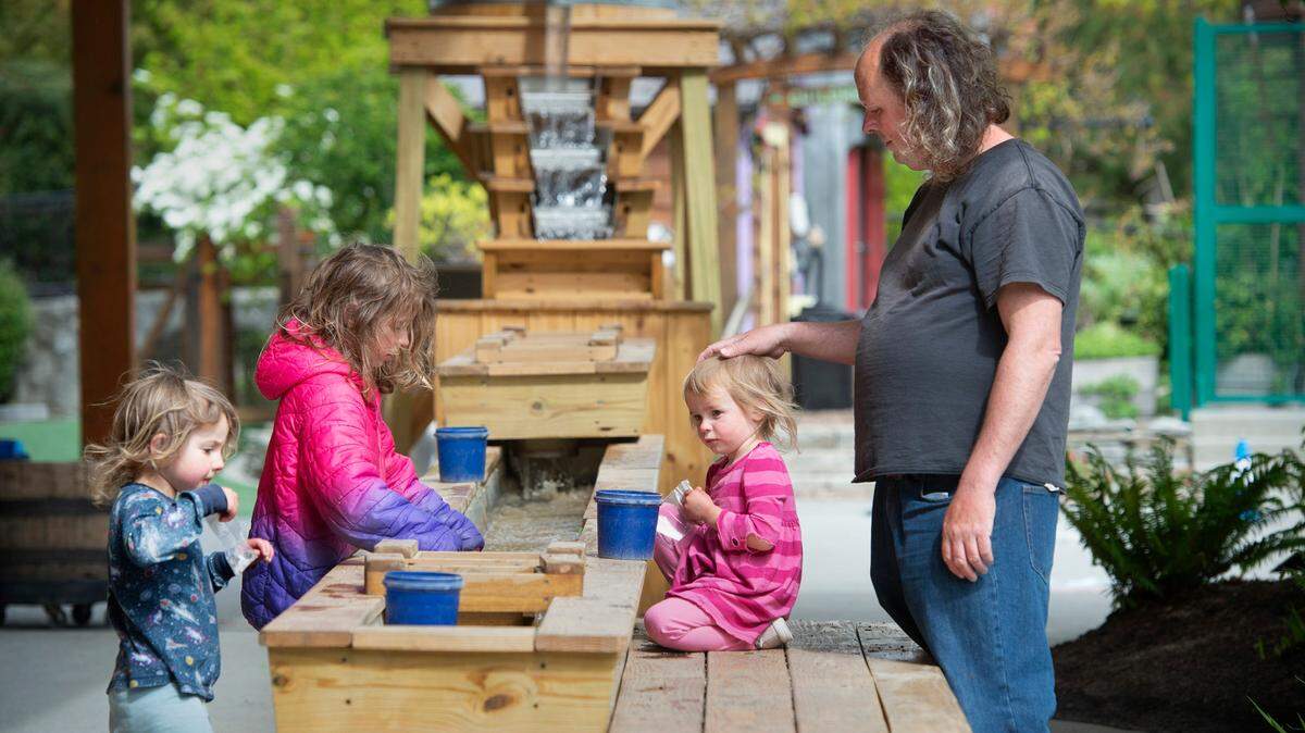 Chris Allert plays with his daughters (from left) Rachel Corrie, 4, Amira, 7, and Susanna, 3, at the Hands On Childrens Museum in Olympia on Friday, May 13. After living in hotel rooms and moving every couple of weeks, Allert received help getting an apartment through a Go Fund Me account.