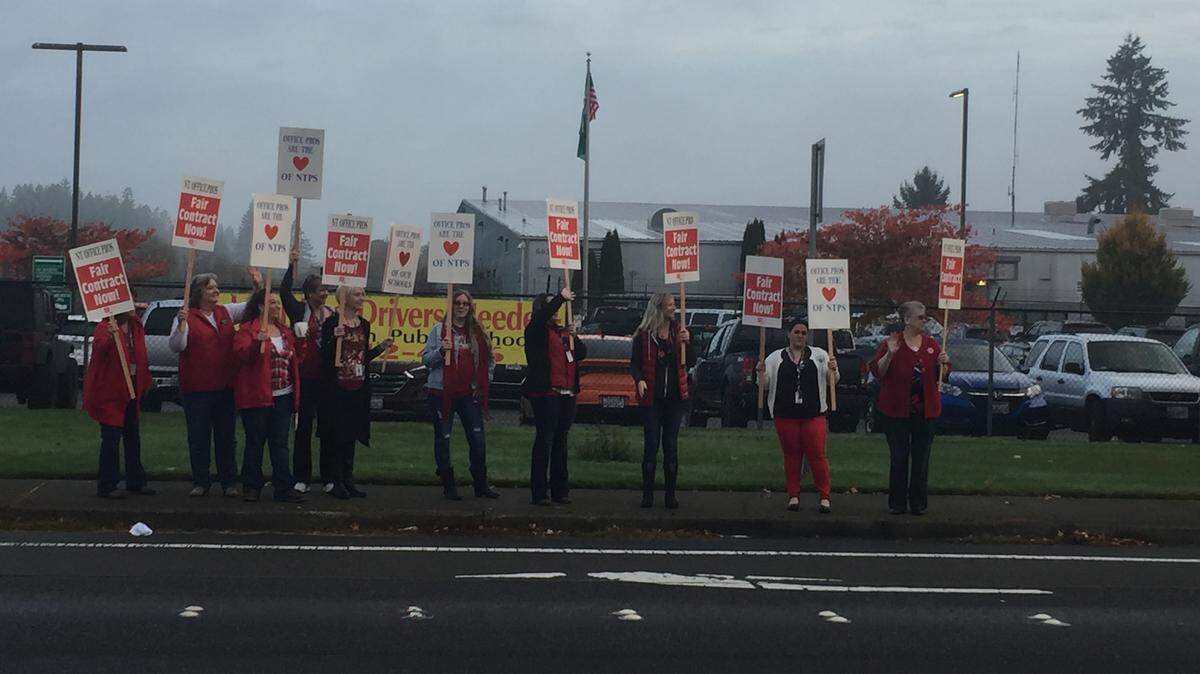 Office workers with North Thurston Public Schools held a rally last week in front of the North Thurston Public Schools service center.
