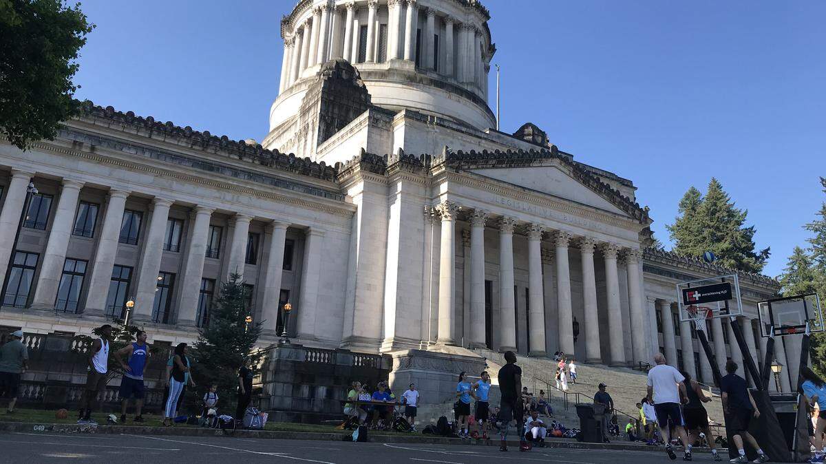 Teams participate in the inaugural Capital City 3-on-3 Basketball Tournament in front of the Legislative Building. The tournament is being put on 90ten Training Academy, a local youth athletic organization.