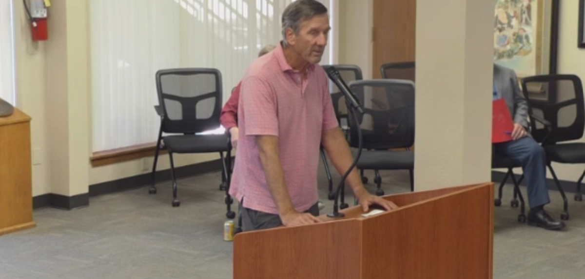 Former Port of Olympia commissioner Joe Downing speaks during public comment at Monday’s port commission meeting.