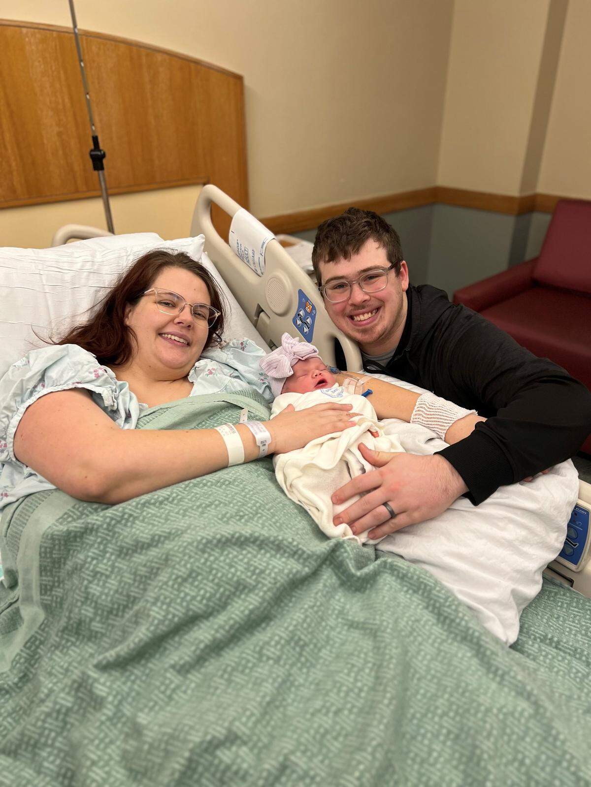 Parents Julianna and Zach Meisling with baby Freya.