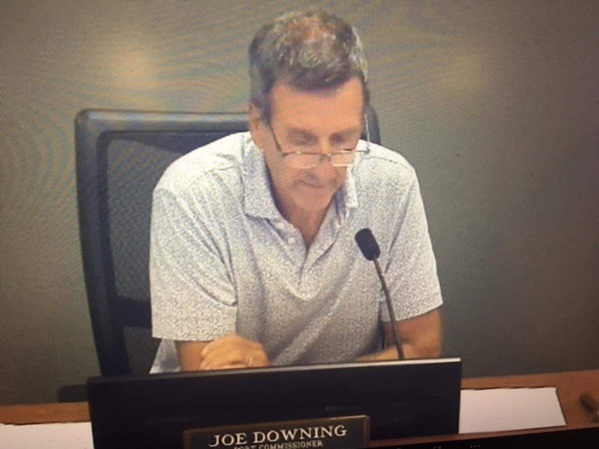 Port of Olympia Commissioner Joe Downing reads his prepared remarks about the KGY radio station building during Monday’s commission meeting.