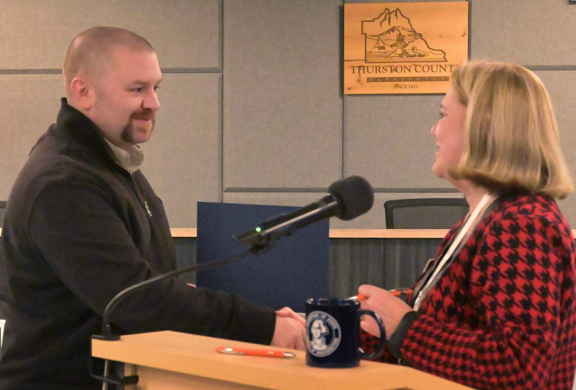 Elected as the Thurston County Dist. 4 Commissioner Wayne Fournier receives his certificate of office from Auditor Mary Hall during a Nov. 28, 2023 swearing-in ceremony at the Atrium building in Olympia. Still serving as the Mayor of Tenino until later that evening Fournier was to officially resign at his last city council meeting, then immediately be given the Oath of Office for his new position by County Commissioner Carolina Mejia.