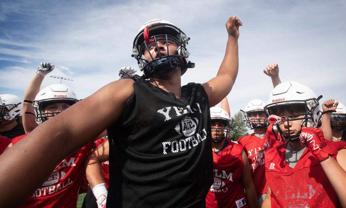 Yelm linebacker Isaiah Patterson leads the Tornados to a break during preseason football practice at Yelm High School in Yelm, Washington, on Thursday, Aug. 17, 2023.