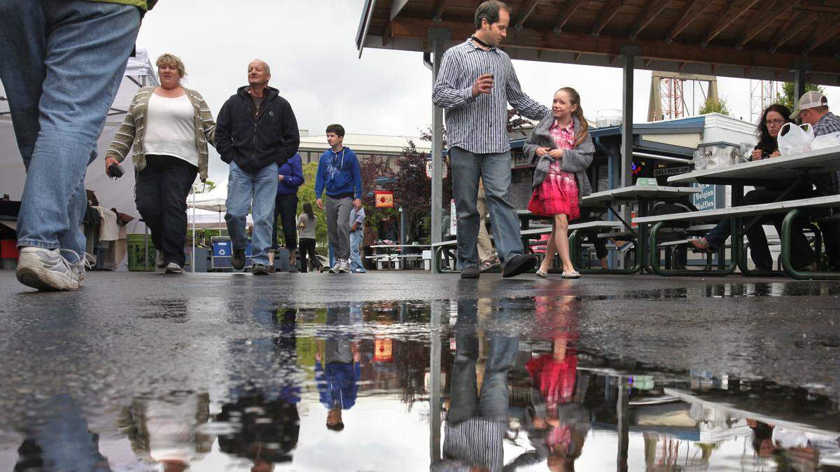 Olympia Farmers Market shoppers should be prepared to get wet this week -- as these shoppers did in June 2012 -- because rain and cooler temperatures are moving into the area.