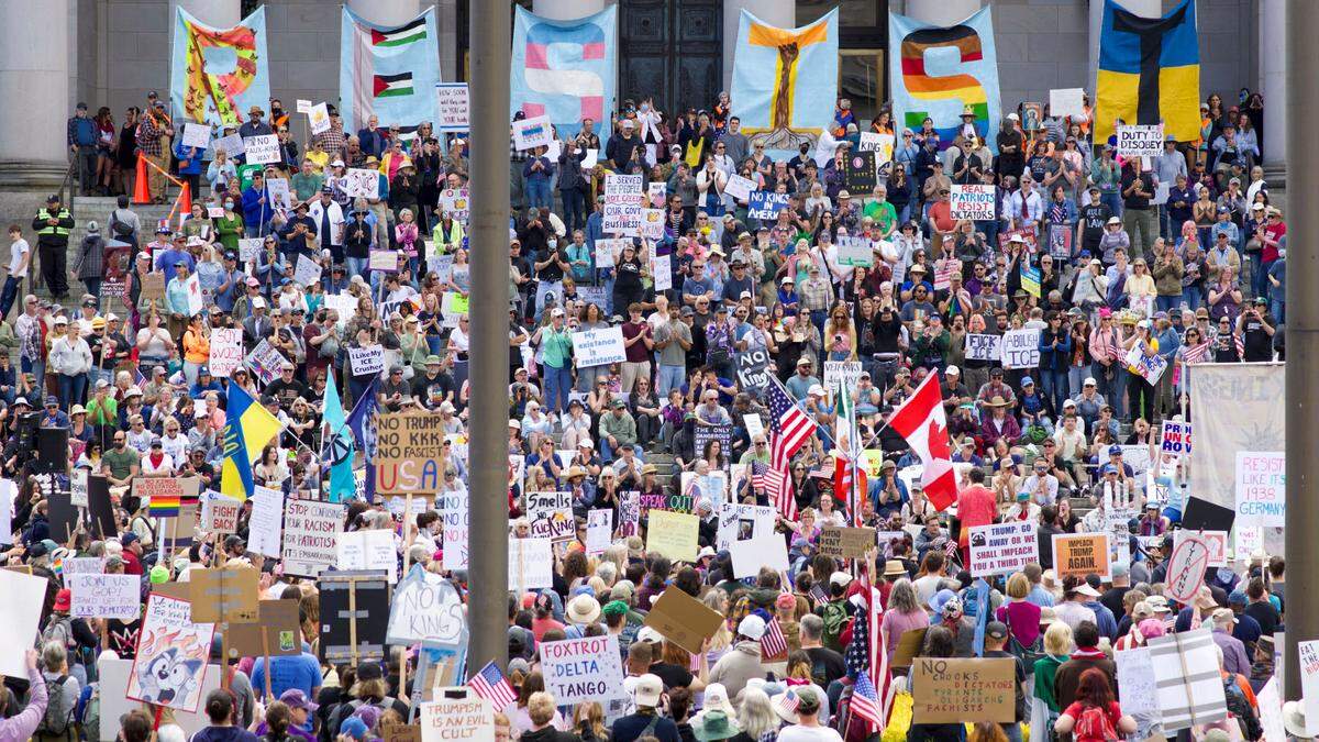 Demonstrators filled the steps of the Legislative Building in Olympia during the “No Kings” protest against President Donald Trump on Saturday, June 14, 2025.