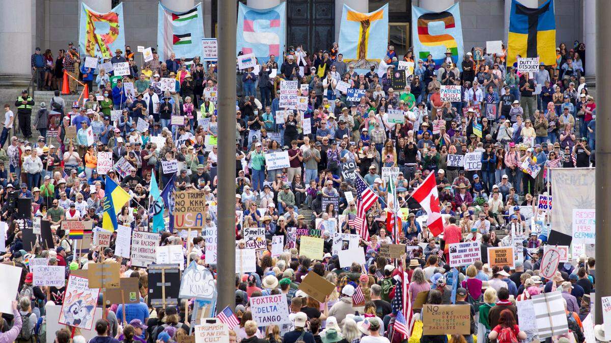 Demonstrators filled the steps of the Legislative Building in Olympia during the “No Kings” protest against President Donald Trump on Saturday, June 14, 2025.