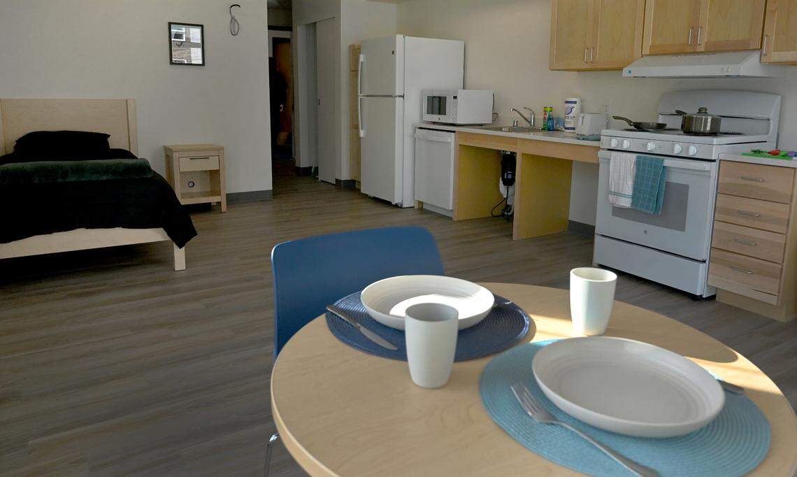 Visitors tour the new Lotus Court supportive housing apartment during its grand opening on Oct 9, 2024. Located at 111 Pattison St. NE in Olympia the 64-unit complex will house seniors 55 years and older including those with disabilities and is operated by the Low Income Housing Institute.