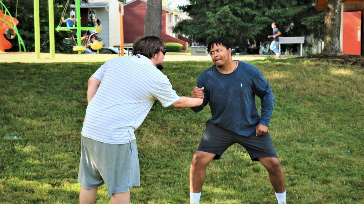 The noble Orlando (Jalen Penn, right) faces off against court wrestler Charles (Joe Shay) in a rehearsal at Olympia’s Sunrise Park for Goldfinch Productions’ ”As You Like It.”