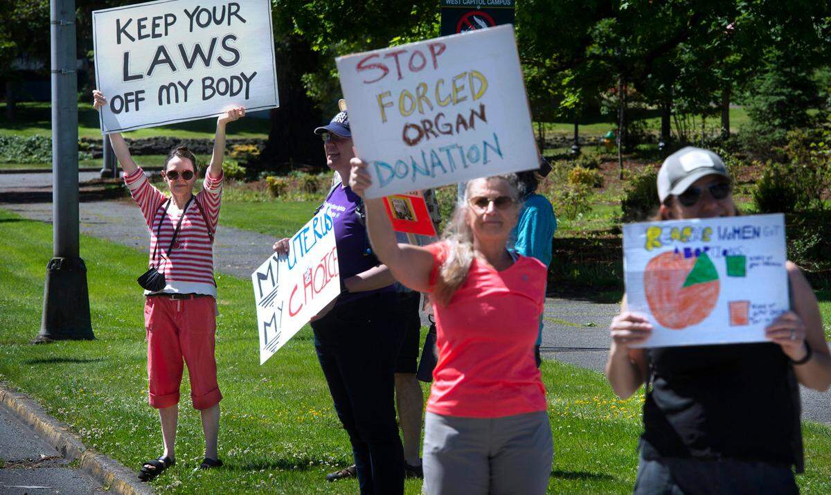 Lynette Serembe of Olympia joins a few dozen women’s rights supporters to rally on the Capitol Campus in Olympia, Washington on Friday, June 24, 2022, following the morning’s announcement of the U.S. Supreme Court’s overturning of Roe v Wade.