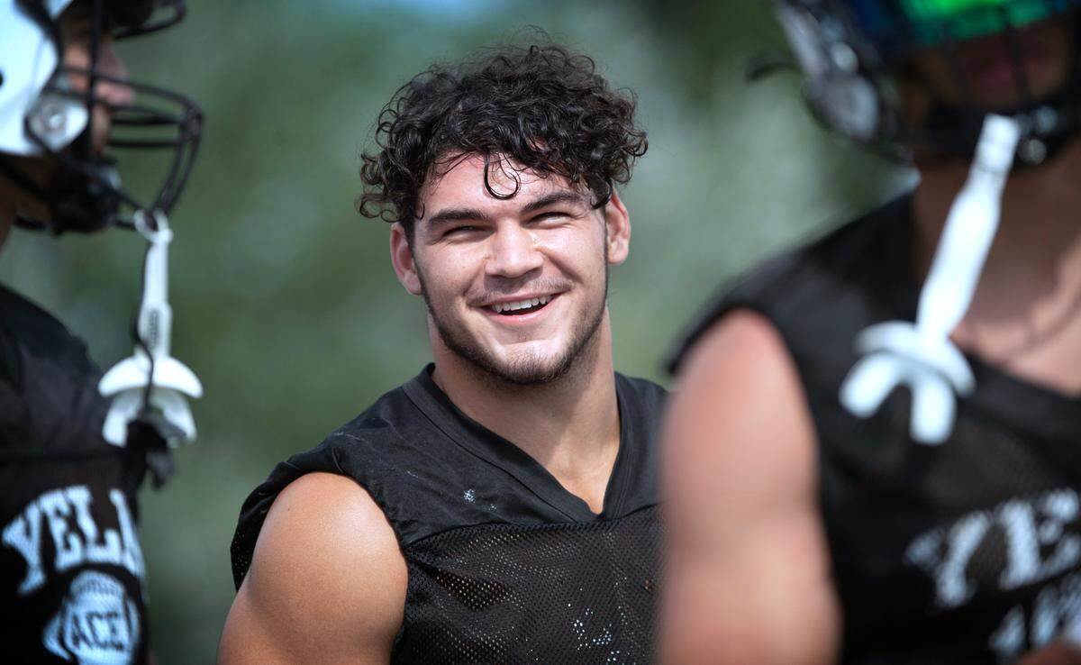 Yelm running back Brayden Platt takes a break between drills during the Tornados’ preseason football practice at Yelm High School in Yelm, Washington, on Thursday, Aug. 17, 2023.