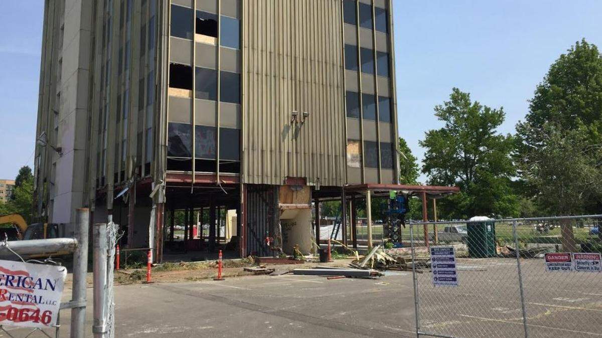 Crews have started removing the windows and exterior of the long-vacant Capitol Center Building on Fifth Avenue Southwest. A judge last week dismissed a legal challenge to the building project.