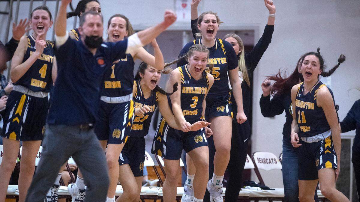 The Burlington-Edison Tigers erupt as time expires in their upset victory over the top-ranked Tumwater T-Birds in Saturday night’s 2A girls basketball state tournament regional-round game at WF West High School in Chehalis, Washington, on Feb. 26, 2022. Burlington-Edison won the game, 52-47.