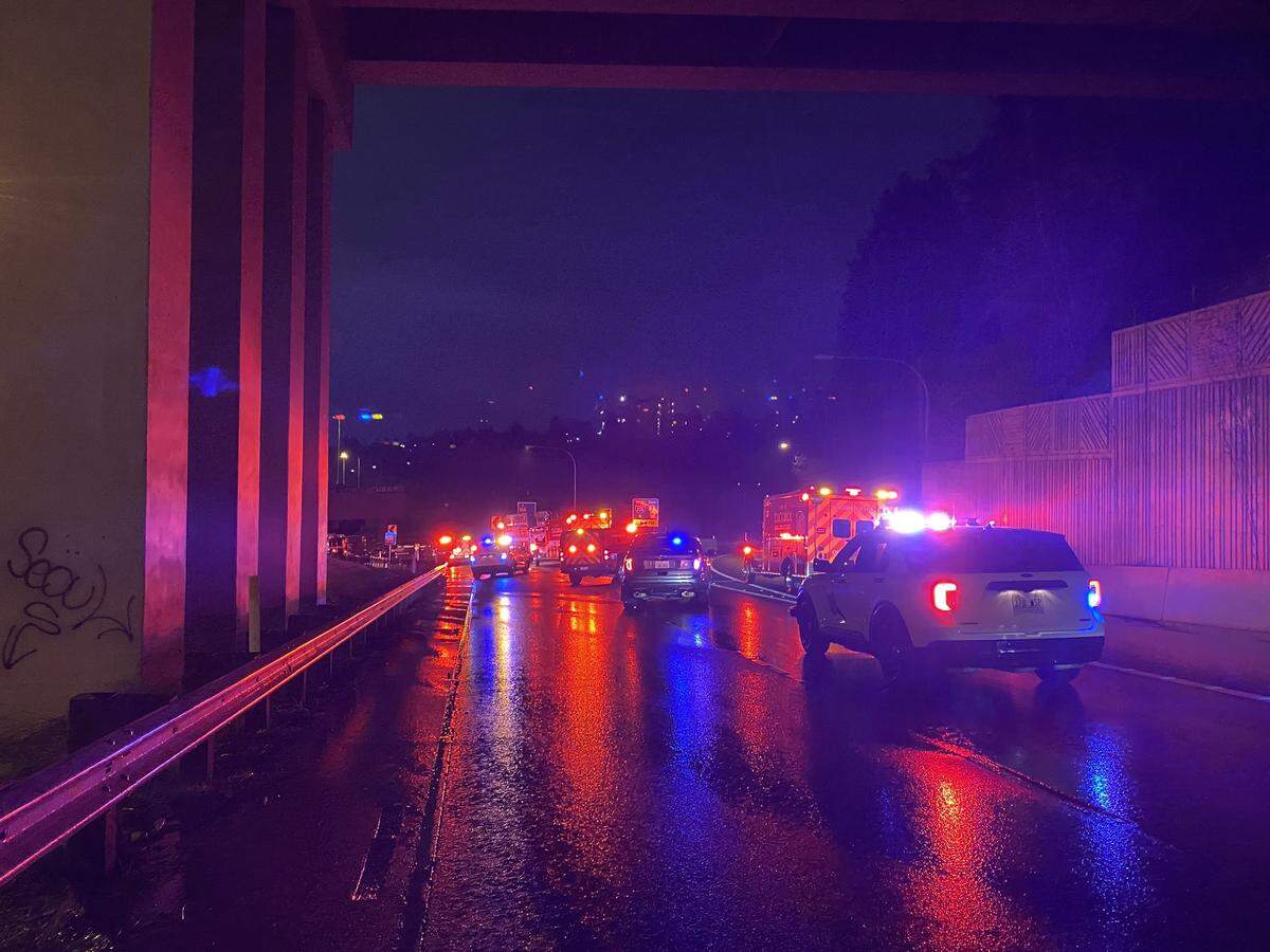 Washington State Patrol and Tacoma Fire Department units respond to a fatal collision on the ramp from Interstate 5 to Interstate 705 in Tacoma on Sunday, April 2, 2023.