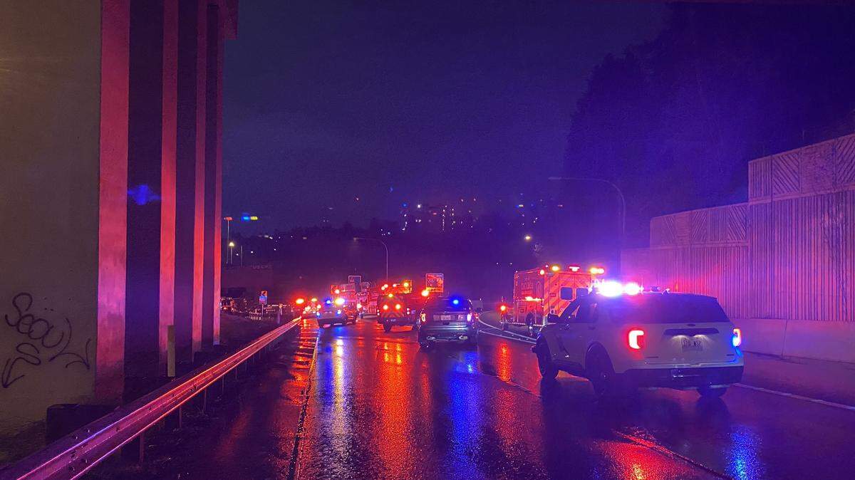 Washington State Patrol and Tacoma Fire Department units respond to a fatal collision on the ramp from Interstate 5 to Interstate 705 in Tacoma on Sunday, April 2, 2023.