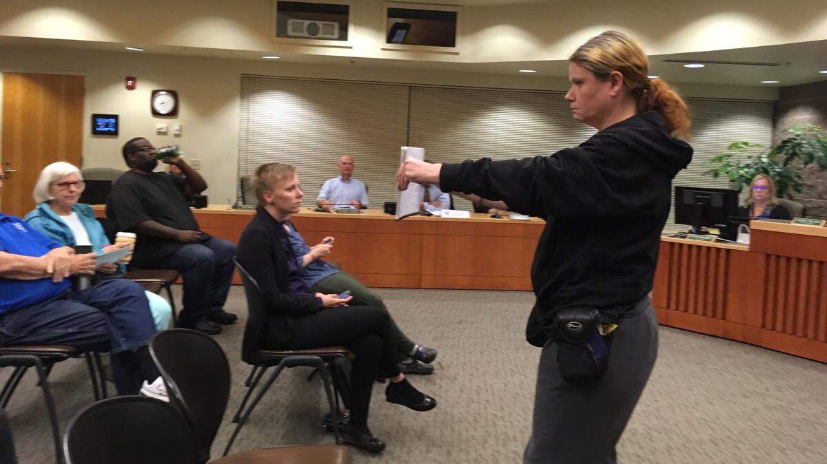 Phoenix Wendt, angered by Lacey City Council’s 6-1 approval of a more restrictive parking ordinance, confronted the council before and after the vote and was eventually asked to leave council chambers Thursday night. Here, she turned her back on the council and faced the council audience.