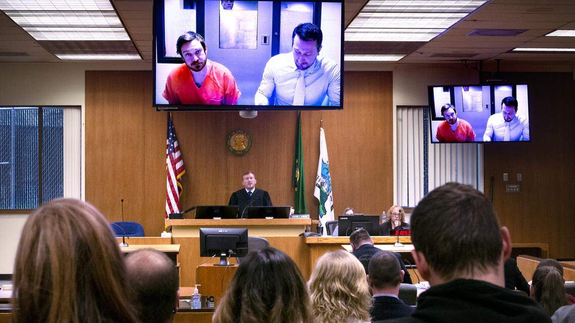 Nicholas J. Denham appears via video screen with his court-appointed attorney Eric Pilon for his preliminary court apperance before Judge Chris Lanese in Thurston County Superior Court in Olympia on Friday, March 13, 2020.