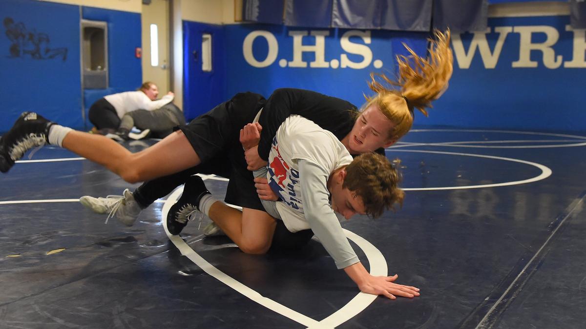 Olympia High School wrestlers Karlee Mosser (in front) and Erica Grant work with their practice partners Jackson Twitty and Jared Nelson Tuesday afternoon in preparation for this weekend’s girls’ regional tournament which the Bears’ are hosting.