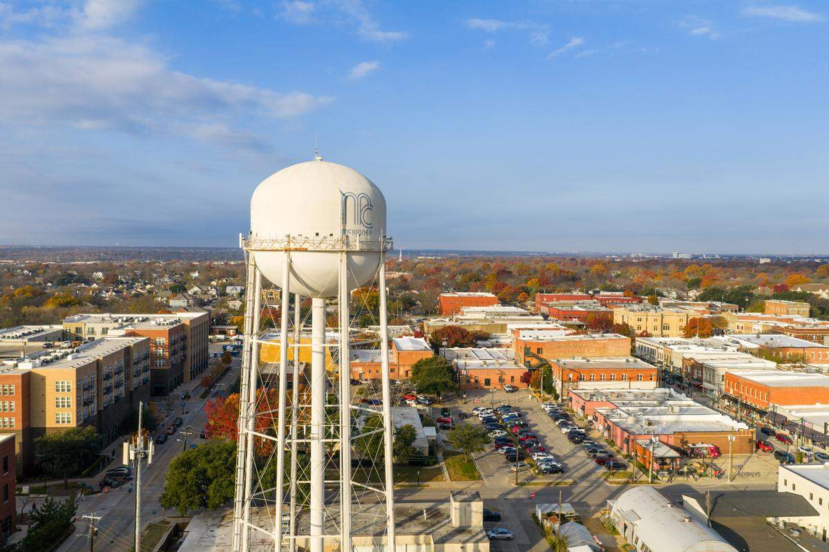 Drone video of downtown McKinney, Texas, on a beautiful Autumn day where the leaves on the trees flaunt peak color.