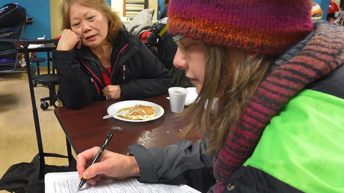 Thurston County Homeless Prevention and Affordable Housing Coordinator Keylee Marineau interviews Ruth Kenny for the 2020 Point in Time Count homeless census project Thursday morning during breakfast at the Community Kitchen at the Salvation Army in Olympia. Kenny is currently staying at Interfaith Works.