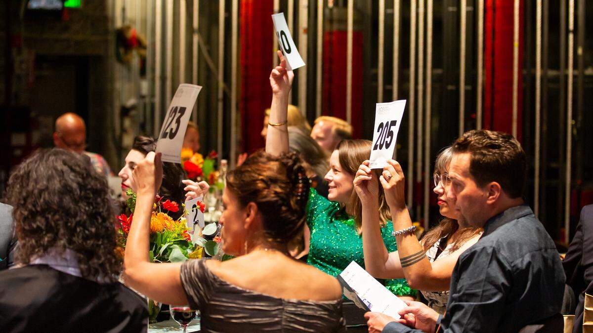 People who attended last year’s Center Stage Gala bid on auction items. This year the auction is online.