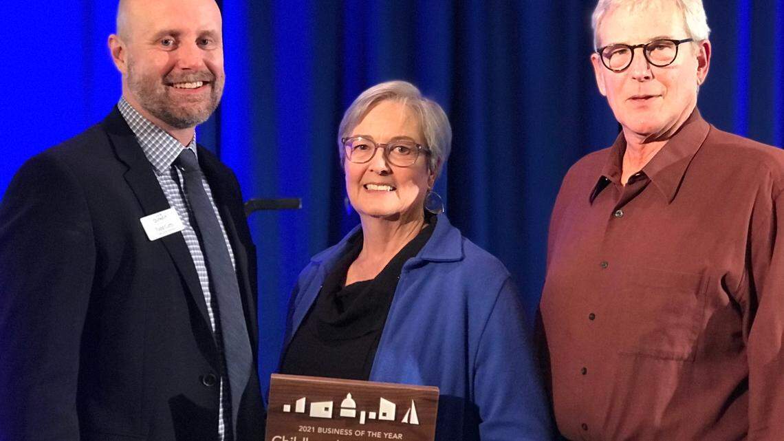 Childhood’s End Gallery owners Richenda (center) and Bill Richardson (right) with Olympia Downtown Alliance Executive Director Todd Cutts.