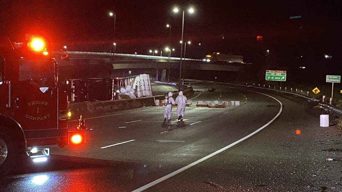 The semi-trailer rolled over Monday night on I-5 near Tumwater, the vehicle blocking all northbound lanes while cargo from the truck blocked southbound lanes, according to Washington State Patrol.