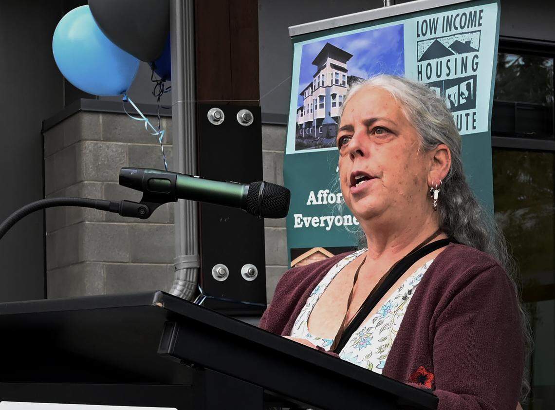 One of the first two new residents to move in Ellen Supplee shares her personal story of becoming homeless after losing her family farm due to injury and coming full circle with a permanent home during the dedication grand opening of the new Lotus Court supportive housing apartment on Oct 9, 2024. Located at 111 Pattison St. NE in Olympia the 64-unit complex will house seniors 55 years and older including those with disabilities and is operated by the Low Income Housing Institute.