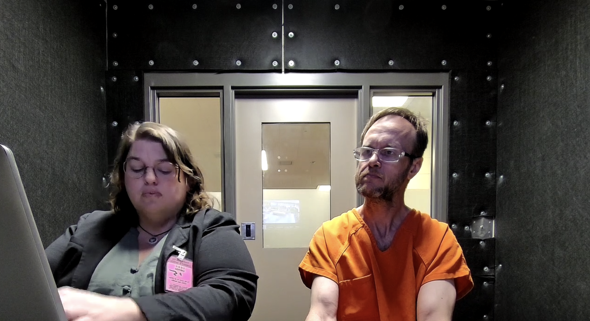 Jeffrey Zizz, 47, (right) virtually attends his preliminary appearance in Thurston County Superior Court from a jail booth on Monday, April 21, 2025. He’s accused of murdering Marcia Norman, 82, on or about April 1-2 and burying her remains under a shed in Olympia before fleeing the state.