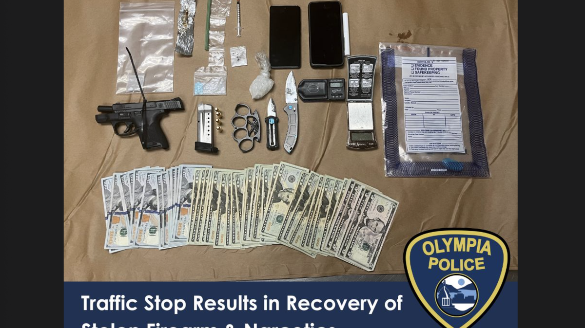 The Olympia Police Department shared a photo of a handgun, drugs, money and more that officers recovered after a traffic stop on Saturday, Nov. 2, 2024.