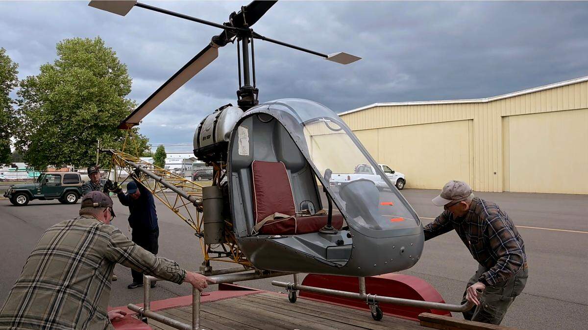 From left, Olympic Air Show volunteers Tom Thorning, John Sabo, Izzy Velez and Paul Knight unload the newly restored Bo 102 training helicopter for short-term storage at the hangar. With only 18 produced, the rare, 1950s era German training helicopter that flew tethered only a few meters above the ground for flight instruction was on display at the Olympic Flight Museum’s 2023 Olympic Air Show. The air show returns June 15-16.