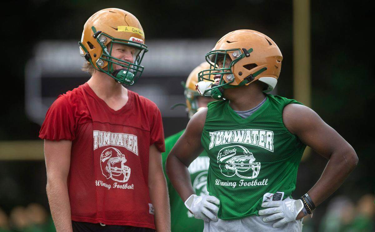 Tumwater seniors quarterback Alex Overbay (left) and running back Carlos Matheney will anchor the T-Birds backfield. They are shown during football practice at Tumwater District Stadium in Tumwater, Washington on Friday, Aug. 19, 2022.