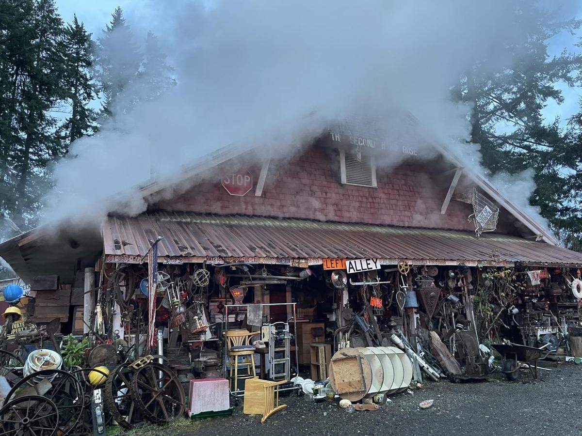 Yelm Highway was completely shut down between Meridian Road and Englewood Drive on Monday morning after a fire broke out in an antique store.