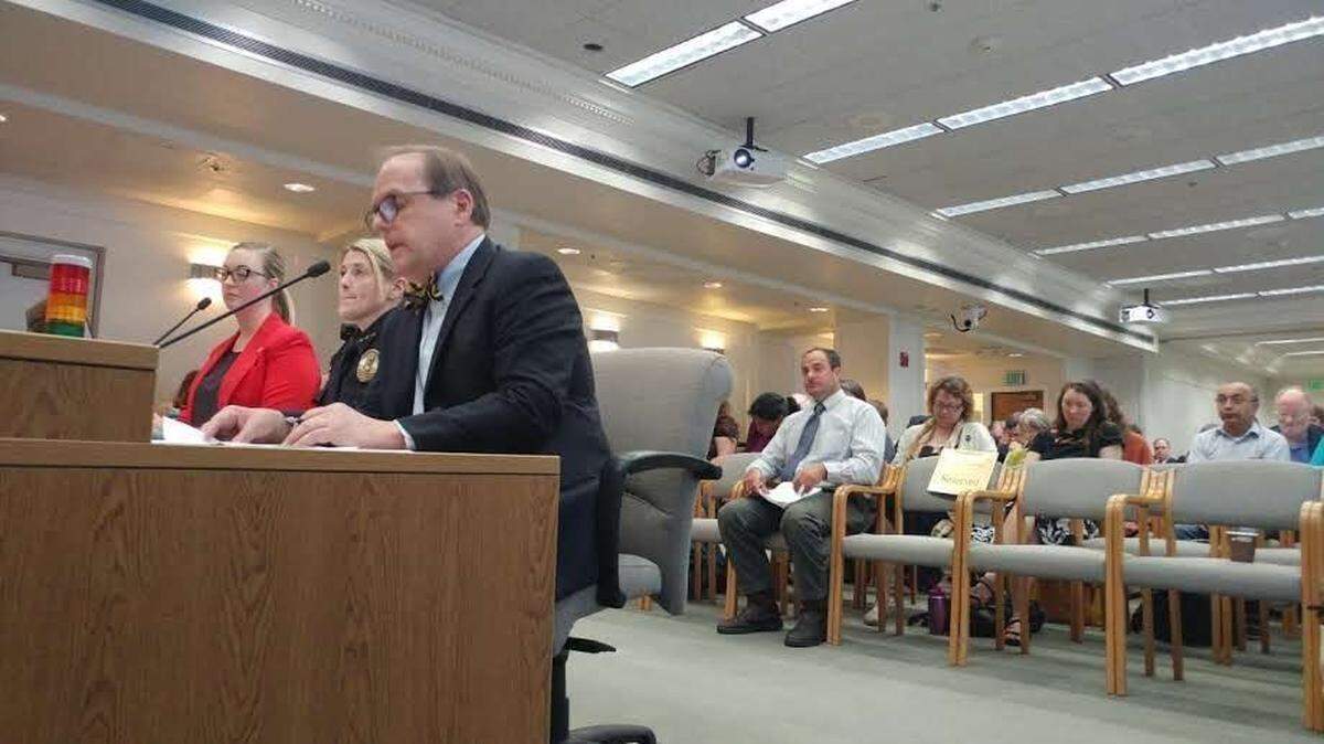 Stacy Brown, center, the former Evergreen police chief, appears before the Washington Senate Law and Justice Committee in June 2017 with Evergreen president George Bridges and Colleen Rust, the college’s director of government relations.