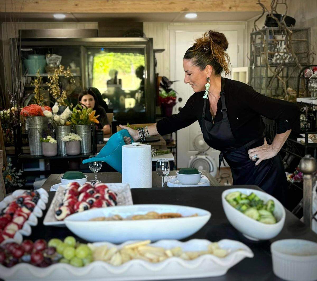 Genevieve Ruth Bryenton, the owner of The Flower & Vine.