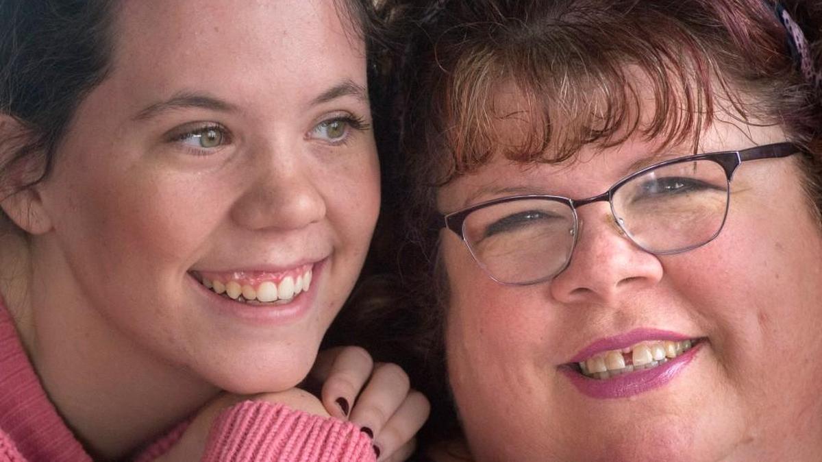 Marti Miller-Hall, right, with her daughter, Olivia, at her home in Graham.