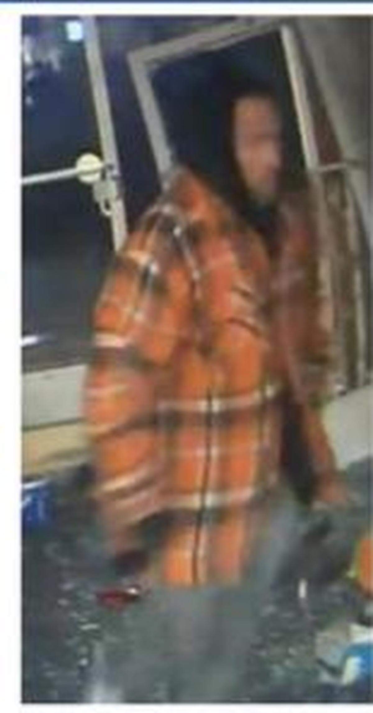 One of the suspects in the Olympic Cards and Comics robbery on Friday.
