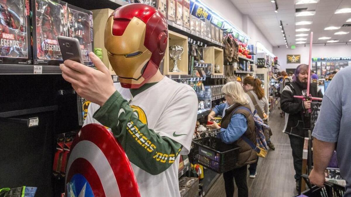 Iron Man, the Green Bay Packers and Captain America come together in a selfie shot by one of the first customers in the newly opened ThinkGeek store in the Tacoma Mall on Friday.