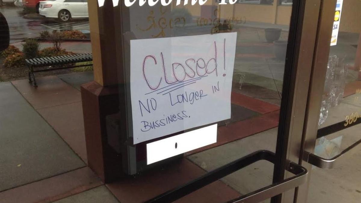 A sign posted on the front door of Chili Thai restaurant in Lacey announces it has closed.