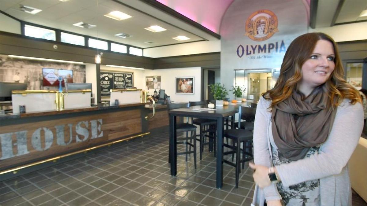 Branch manager Darla Kolbas stands in the new O Bee Credit Union branch in Tenino with the brewpub motif. The credit union was started in 1955 for Olympia brewery employees. The Tenino branch will host a public grand opening event 1-4 p.m. Saturday at 149 Sussex Ave.