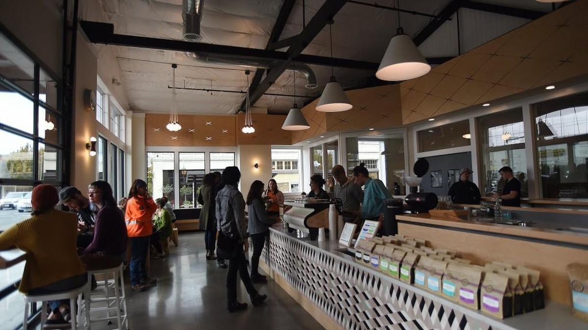
Patrons are bathed in natural lighting Monday as Olympia Coffee Roasting Co. opened its expanded location downtown across from the Olympia City Hall.
