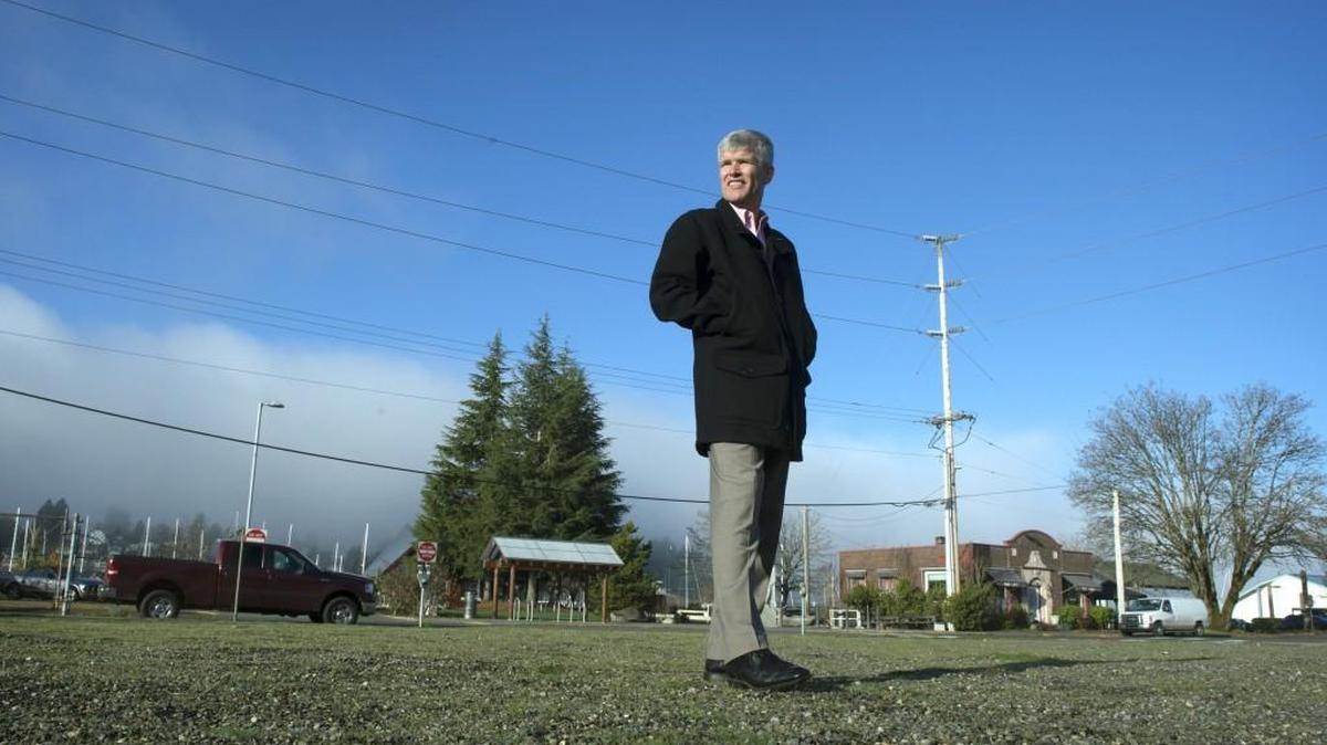 Pat Rants, president and CEO of The Rants Group, shows off the location of its latest planned project, a seven-story condominium building on Columbia Street overlooking Budd Inlet and downtown Olympia on Wednesday, Dec. 6, 2017.