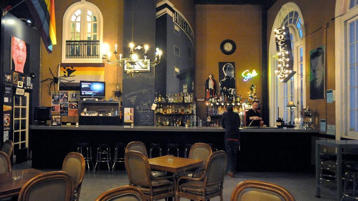 The Urban Onion Restaurant and Lounge employee David Chernoff serves a patron as he opens for dinner Dec 21. After 42 years of business, the longtime local dining establishment is closing Dec 27.