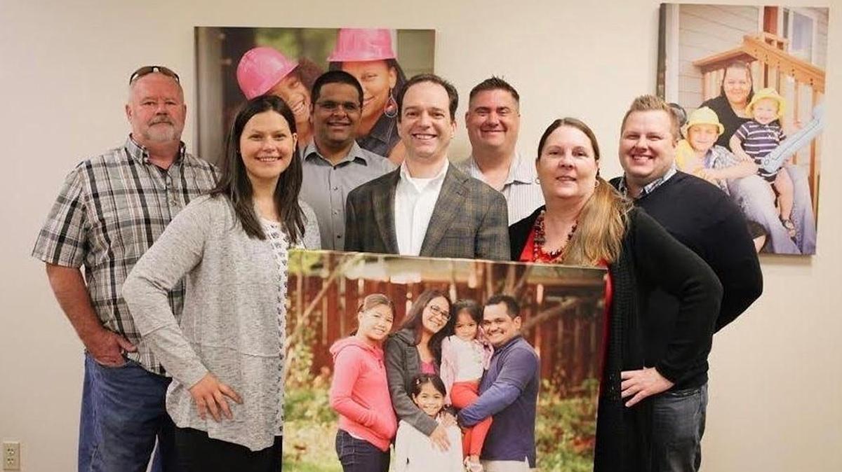 South Puget Sound Habitat for Humanity Executive Director Curt Andino (center) and his staff.